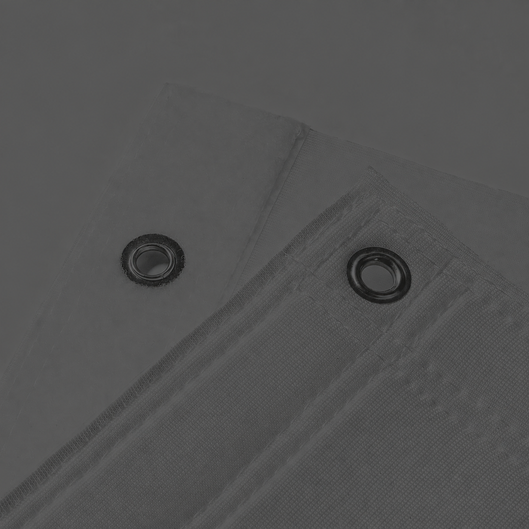 Close-up of golf simulator impact screen fabric with reinforced edges and metal grommets – Golf and Greens buying guide