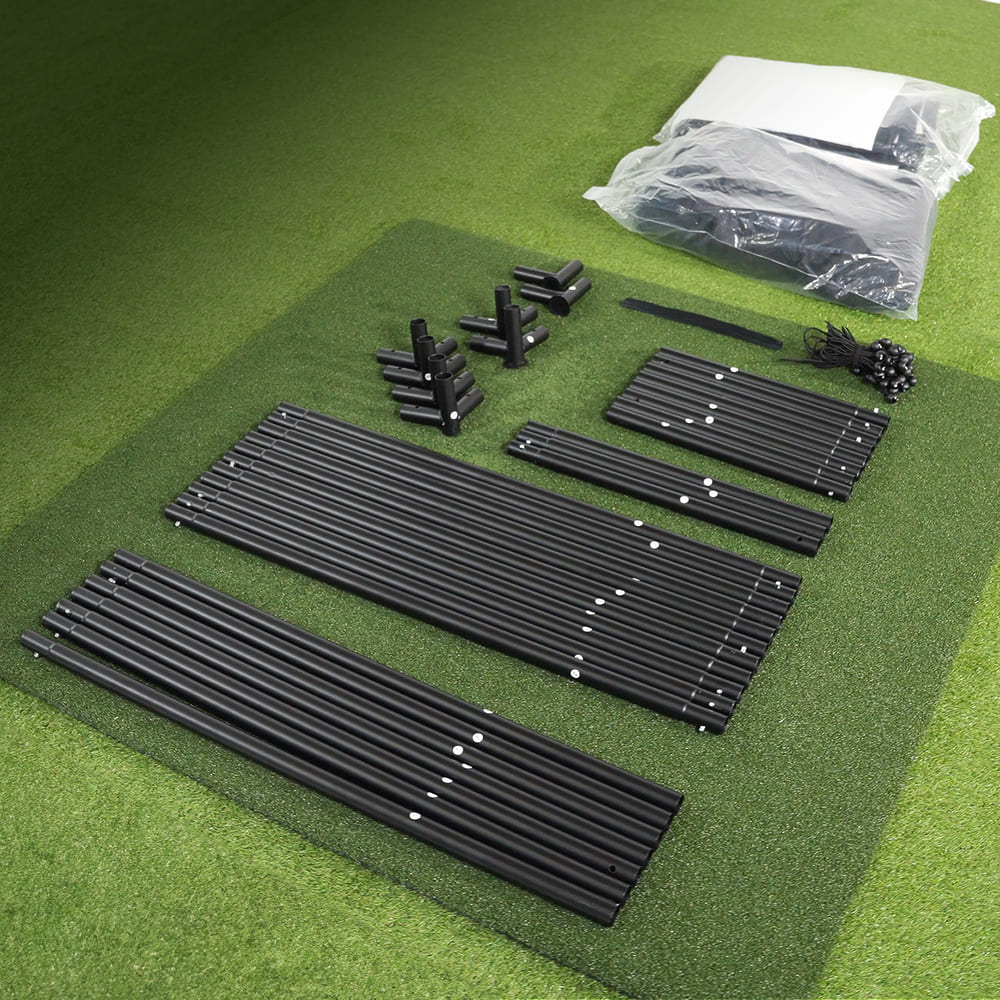 Metal frame tubes, connectors, bungee cords and folded enclosure fabric laid out for assembly