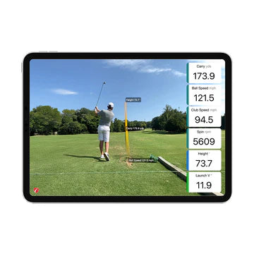 Golfer using FlightScope Mevo Gen2 outdoors with ball speed and carry distance overlay – Golf & Greens