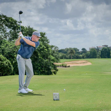 Golfer driving on course with FlightScope Mevo Gen2 portable launch monitor – Golf & Greens