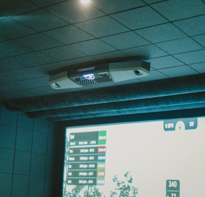 Foresight Falcon launch monitor installed on ceiling in a premium golf simulator room 