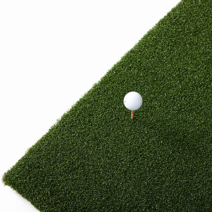 Golf mat with white ball
