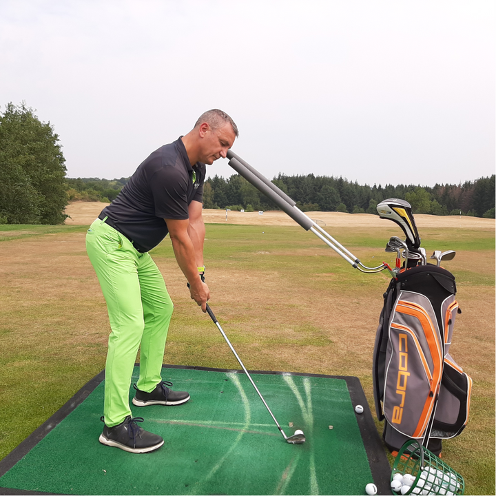 GOSWO HMC Flex Sticks attached to a golf bag for practice