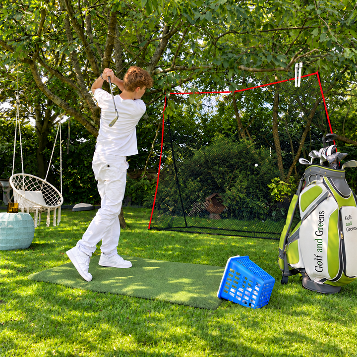Golfer practising with a portable golf net in a garden; mat, golf bag and accessories sold separately