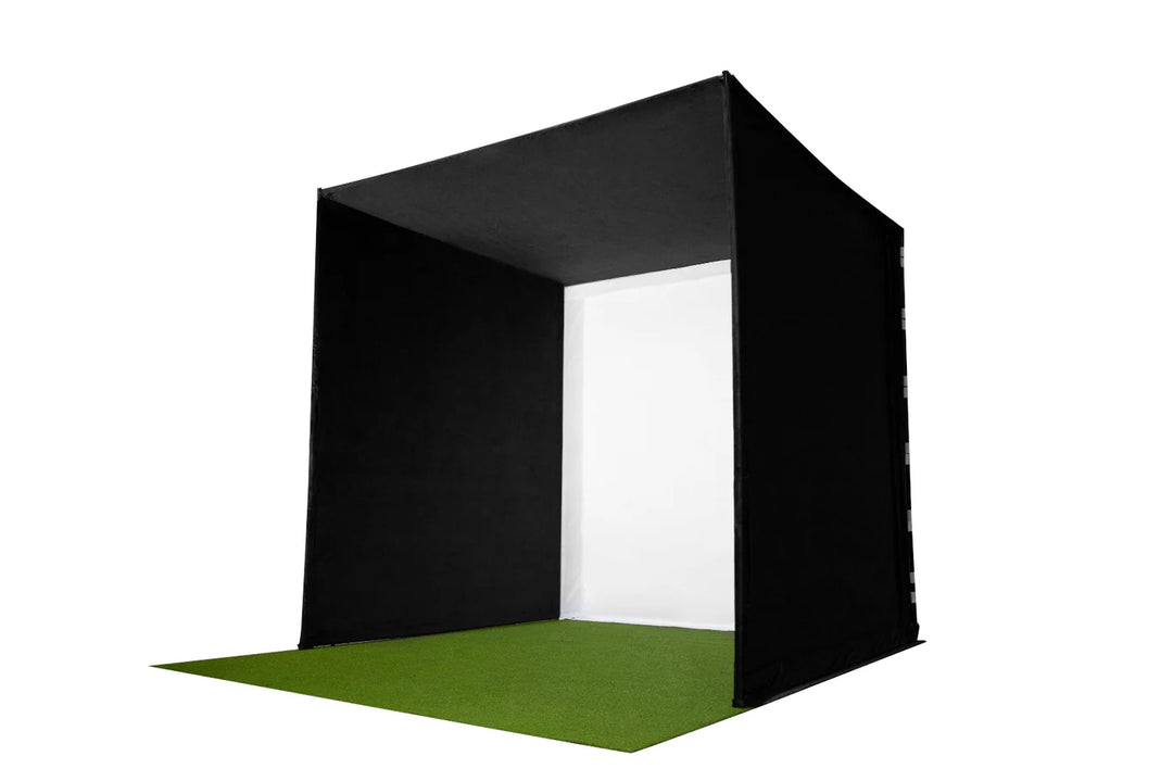 GolfBays SimBox golf simulator enclosure side perspective view with impact screen and turf floor – available at Golf and Greens