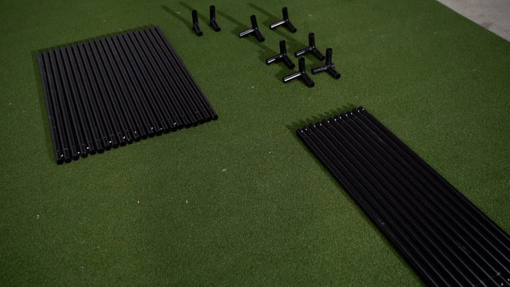 GolfBays SimBox golf simulator frame components laid out for assembly – available at Golf and Greens