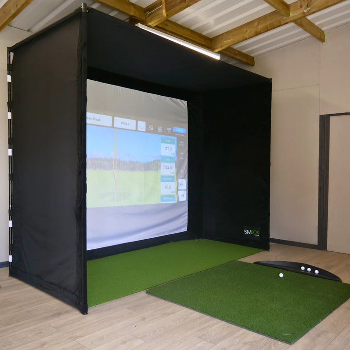GolfBays SimBox golf simulator setup with impact screen and hitting mat – available at Golf and Greens