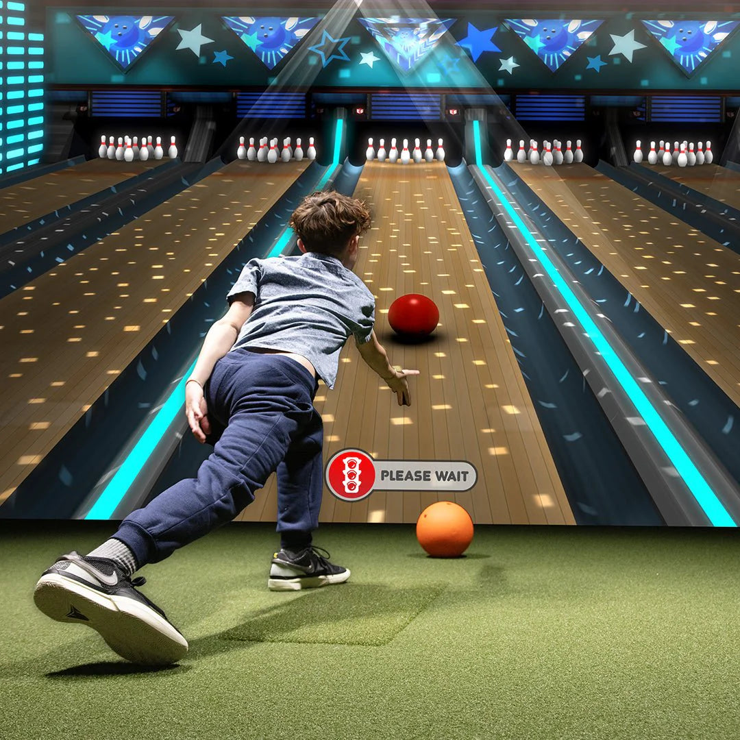 Child playing virtual bowling with TruGolf MultiSport ARCADE simulator – family-friendly sports gaming for home golf simulators
