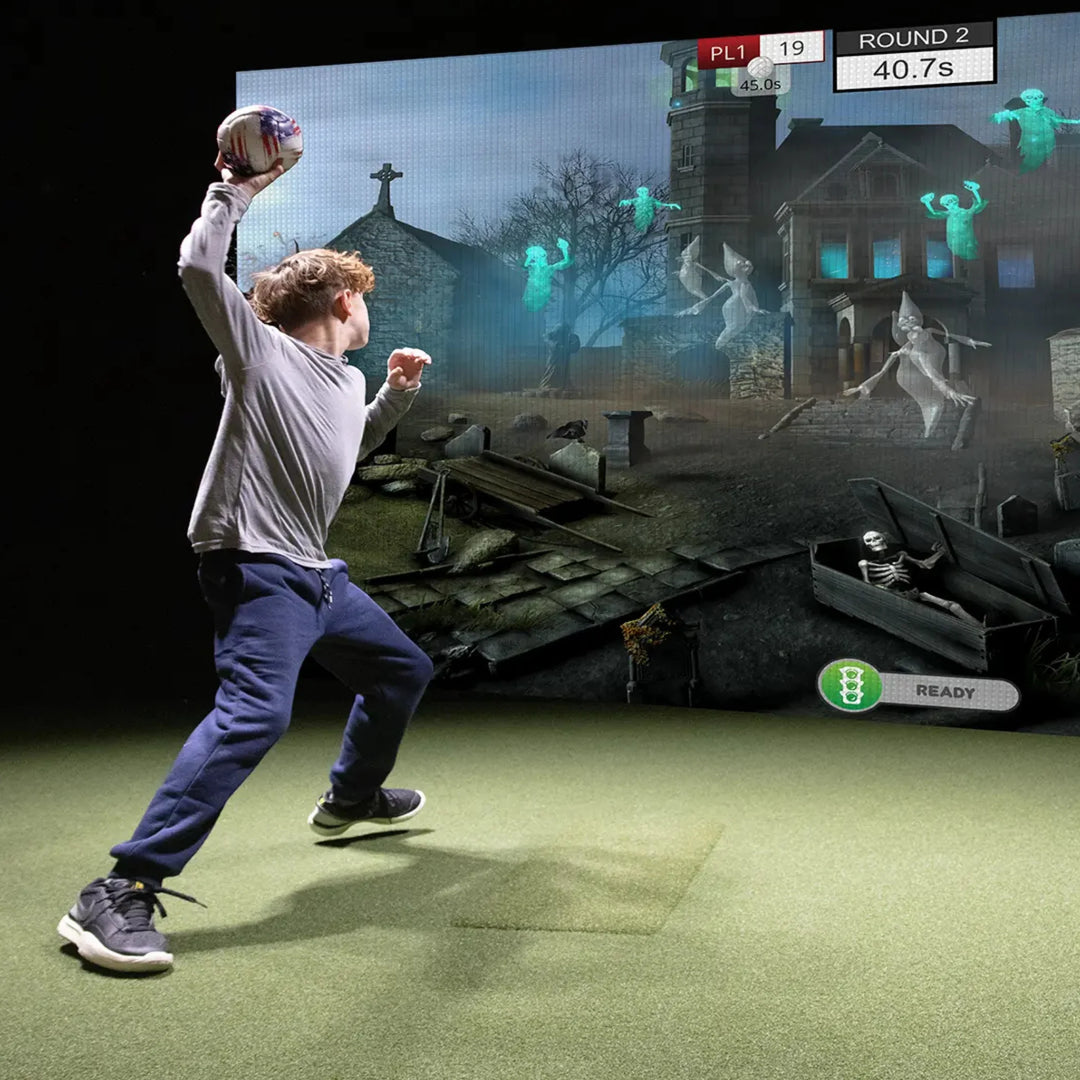 truGolf MultiSport ARCADE – Zombie Dodgeball game with player throwing a ball at virtual zombies.